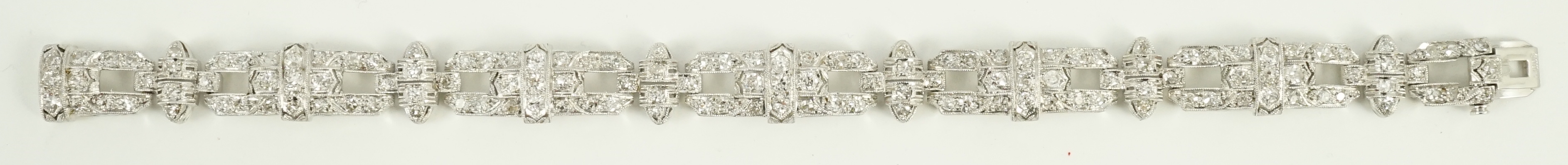 An Art Deco style pierced platinum and diamond cluster set bracelet